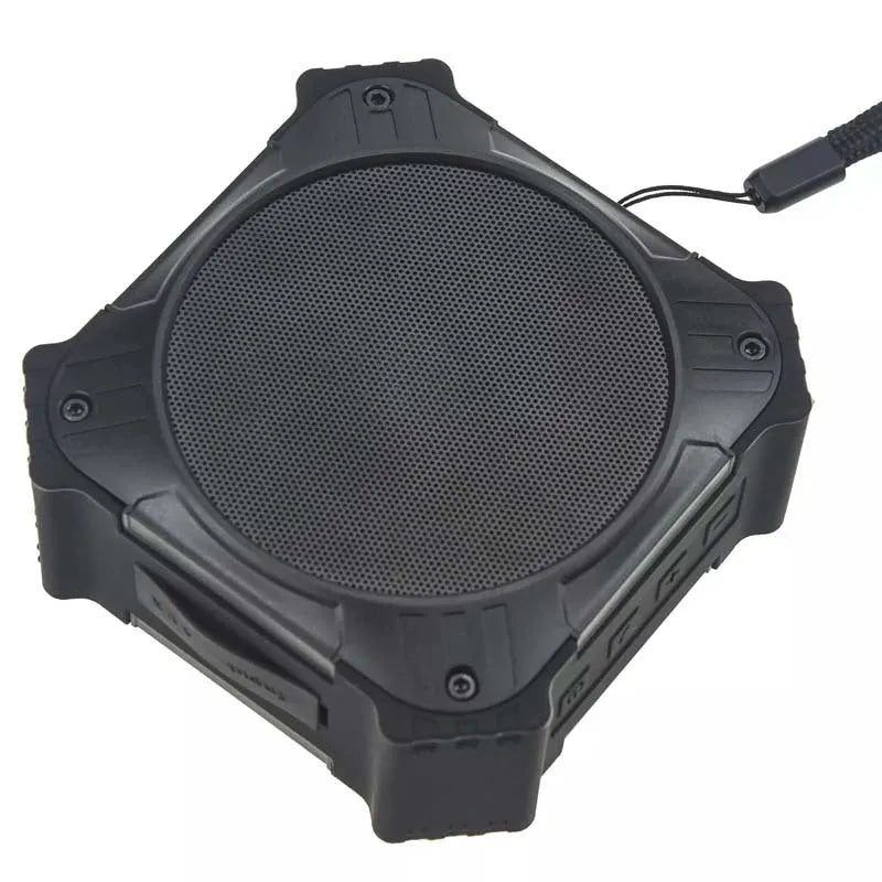 Compact black waterproof Bluetooth speaker with wrist strap showing 101mm cube dimensions