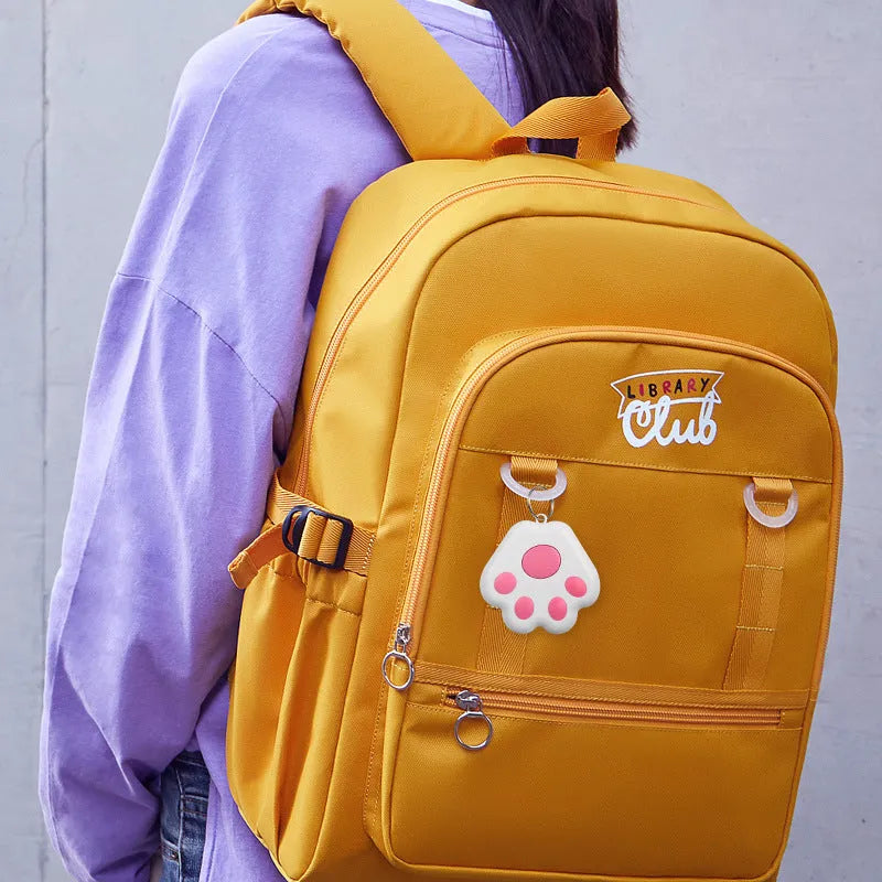 Compact Bluetooth dog tracker with coloured bag and pendant attachment