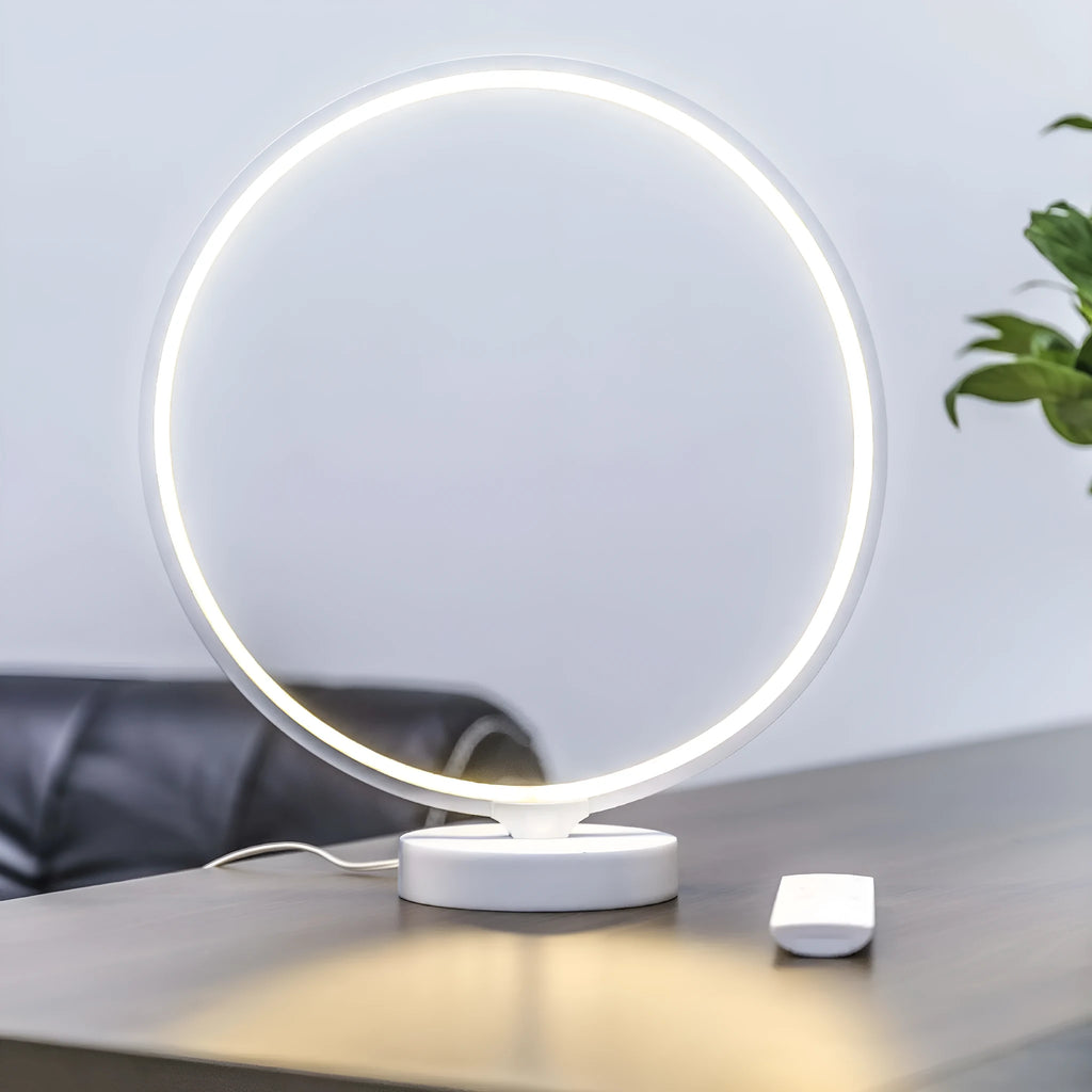 White aluminium and silicone full moon mood table lamp with remote control on wooden surface