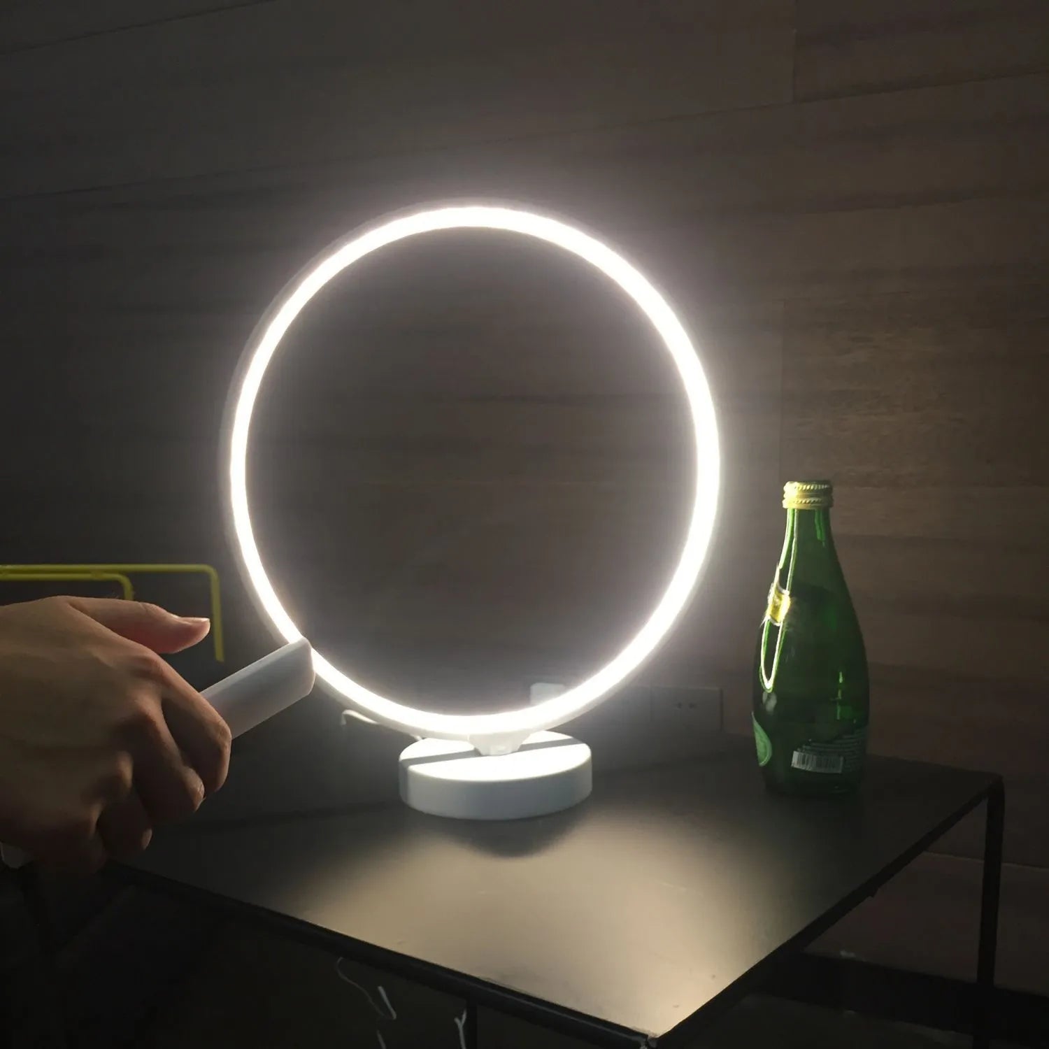 White aluminium and silicone full moon mood table lamp with remote control on wooden surface