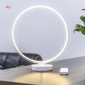 White aluminium and silicone full moon mood table lamp with remote control on wooden surface