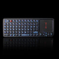 Wireless laser teaching mini keyboard with touch screen and matching optical mouse on black background