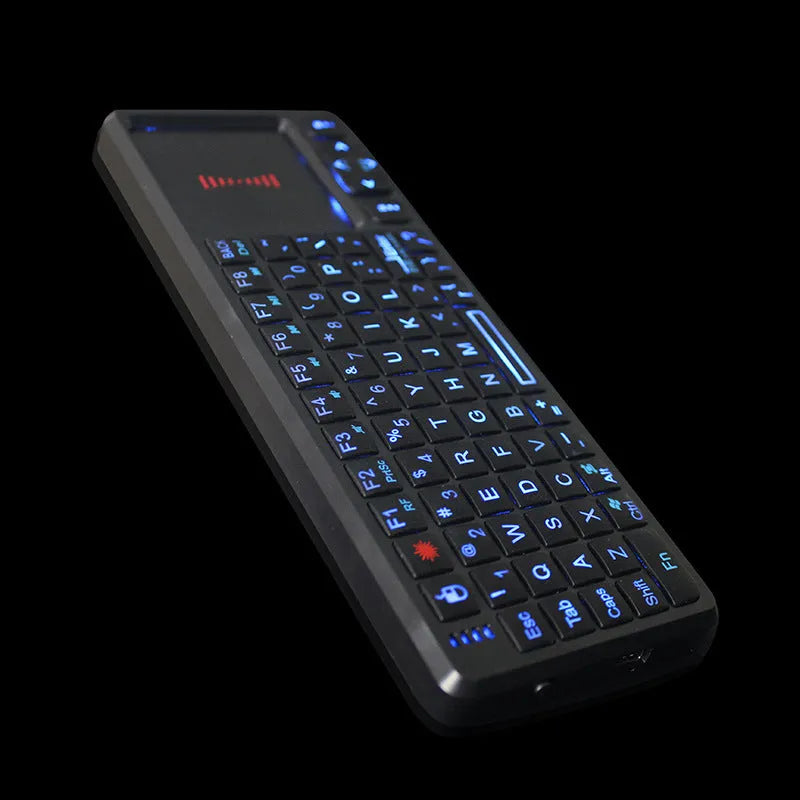 Wireless laser teaching mini keyboard with touch screen and matching optical mouse on black background