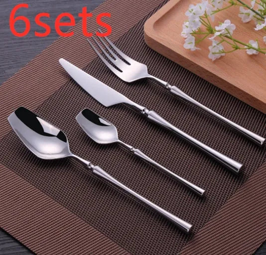 Four-piece stainless steel cutlery set with main knife, main fork, main spoon and teaspoon for gift-giving occasions