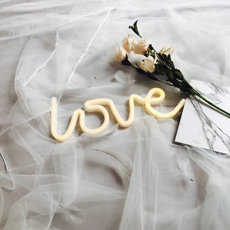 Love-shaped LED neon sign light in pink and warm white colours for indoor wedding decorations