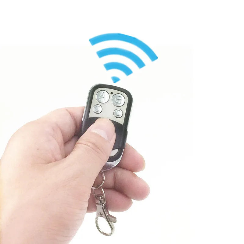 Black metal universal garage door remote with four buttons and 100 metre range