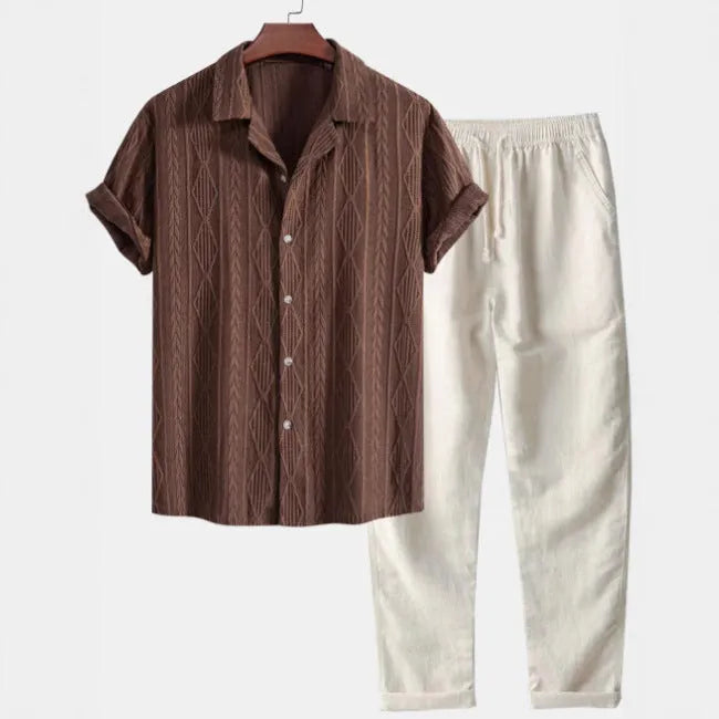 Man wearing a slim-fit camouflage print short-sleeved shirt and matching trousers casual suit set.