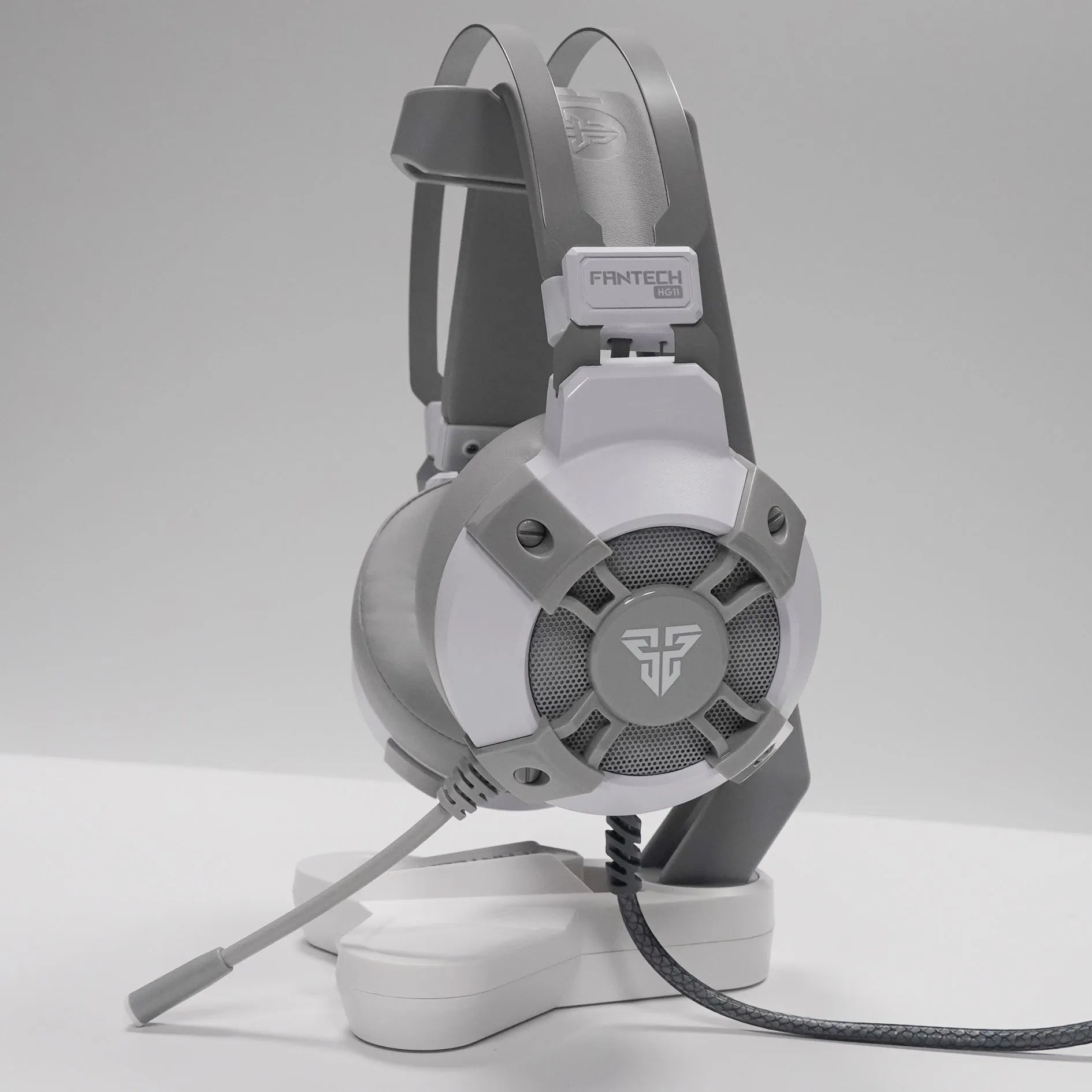 Black FANTECH HG11 USB gaming headset with RGB lights, large ear cups, and a noise-cancelling microphone.