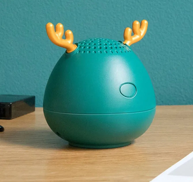 Compact portable Bluetooth speaker in white, pink, or green colour measuring 75mm by 88mm