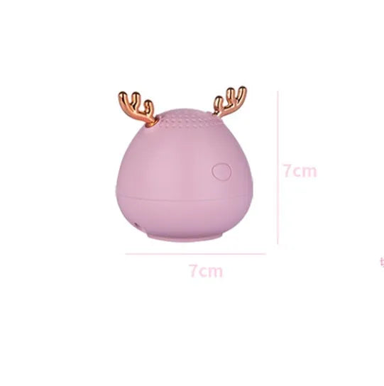Compact portable Bluetooth speaker in white, pink, or green colour measuring 75mm by 88mm
