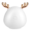 Compact portable Bluetooth speaker in white, pink, or green colour measuring 75mm by 88mm