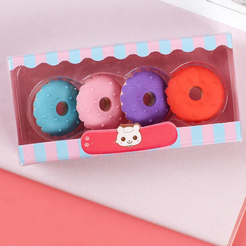 Pack of 12 cartoon erasers in ice cream, donut, and lollipop shapes for children.