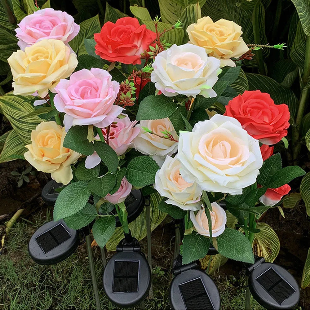 Solar rose garden lamp with three-head white LED lighting and ground spike for outdoor installation