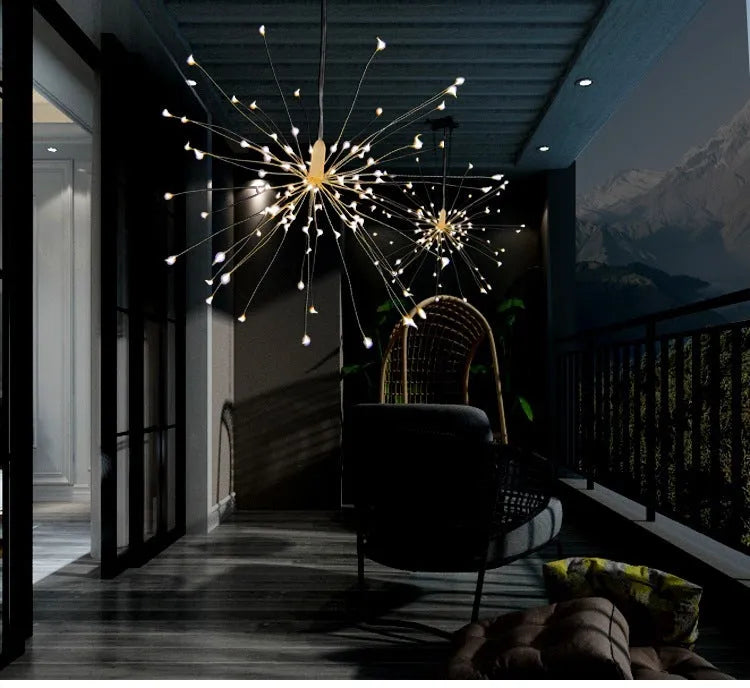 Solar-powered LED meteor shower light with multiple strands creating a warm white firework effect outdoors.