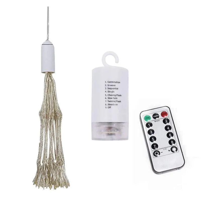 Solar-powered LED meteor shower light with multiple strands creating a warm white firework effect outdoors.