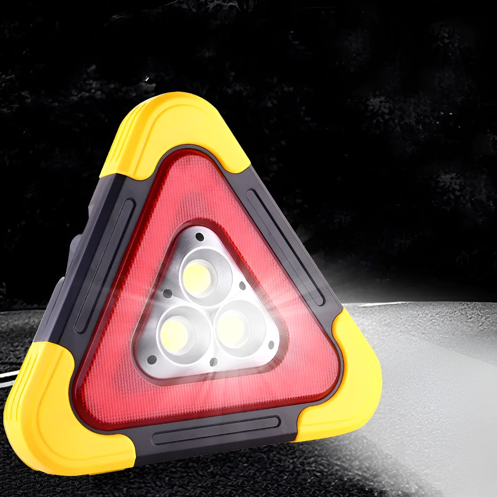 Solar reflective car warning triangle with COB LED light on a road at night