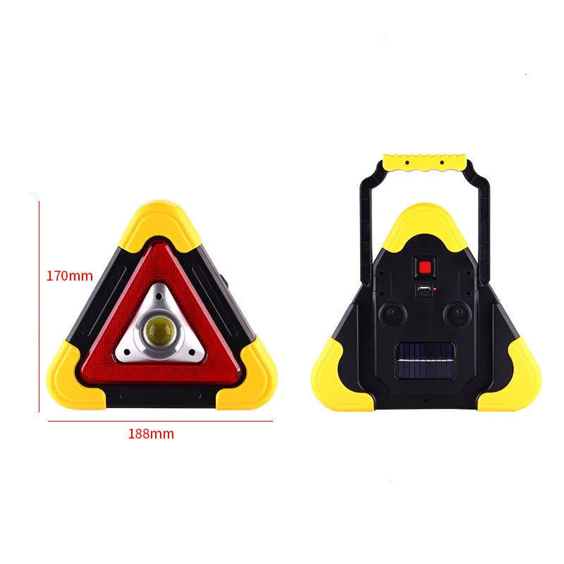 Solar reflective car warning triangle with COB LED light on a road at night