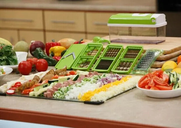 12-piece green manual vegetable chopper set with stainless steel blades on kitchen counter