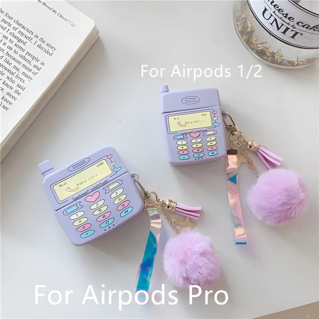 Purple silicone clamshell case for AirPods with fur ball pendant attached
