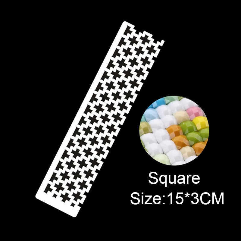 Stainless steel diamond painting grid ruler showing measurement markings for craft alignment
