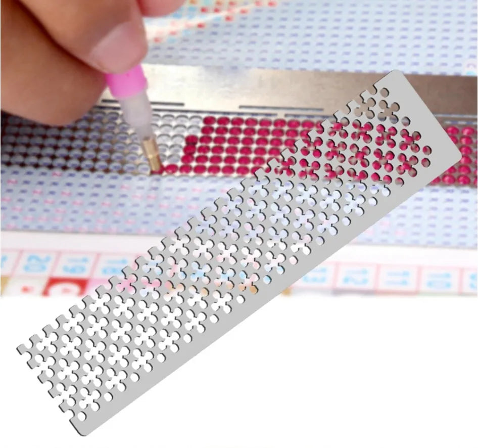 Stainless steel diamond painting grid ruler showing measurement markings for craft alignment