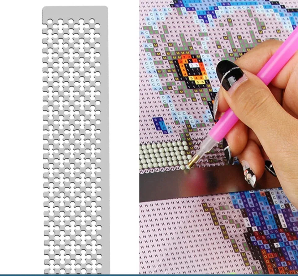 Stainless steel diamond painting grid ruler showing measurement markings for craft alignment