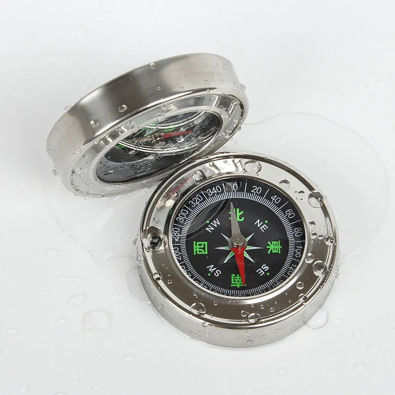 Stainless steel handheld compass for hiking and camping with brushed metal finish, polished bottom, in white or yellow.