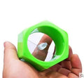 Yellow and green spiral vegetable cutter made from food-grade ABS plastic on a kitchen counter.