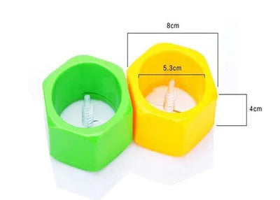 Yellow and green spiral vegetable cutter made from food-grade ABS plastic on a kitchen counter.