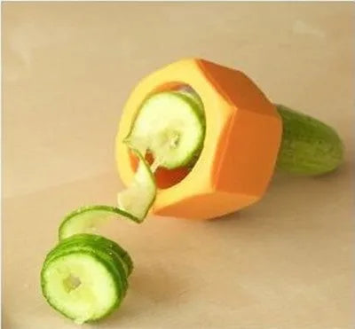 Yellow and green spiral vegetable cutter made from food-grade ABS plastic on a kitchen counter.