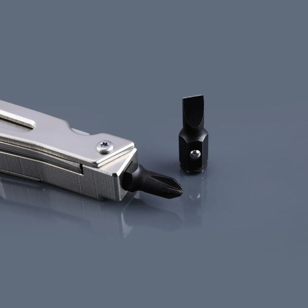 Stainless steel multi-function wrench tool with integrated knife and needle-nose pliers.