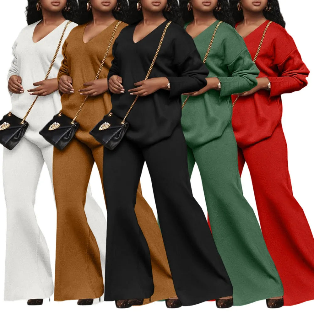 Women's brown suede velvet two-piece casual suit with long sleeves and trousers on a hanger.