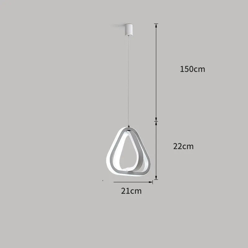 Black minimalist iron chandelier with remote control on a wooden bedside table.