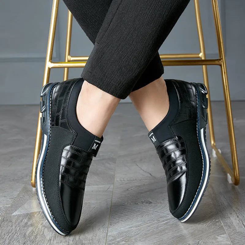 Men's low-top casual leather shoes in blue, showing leather upper and classic design.