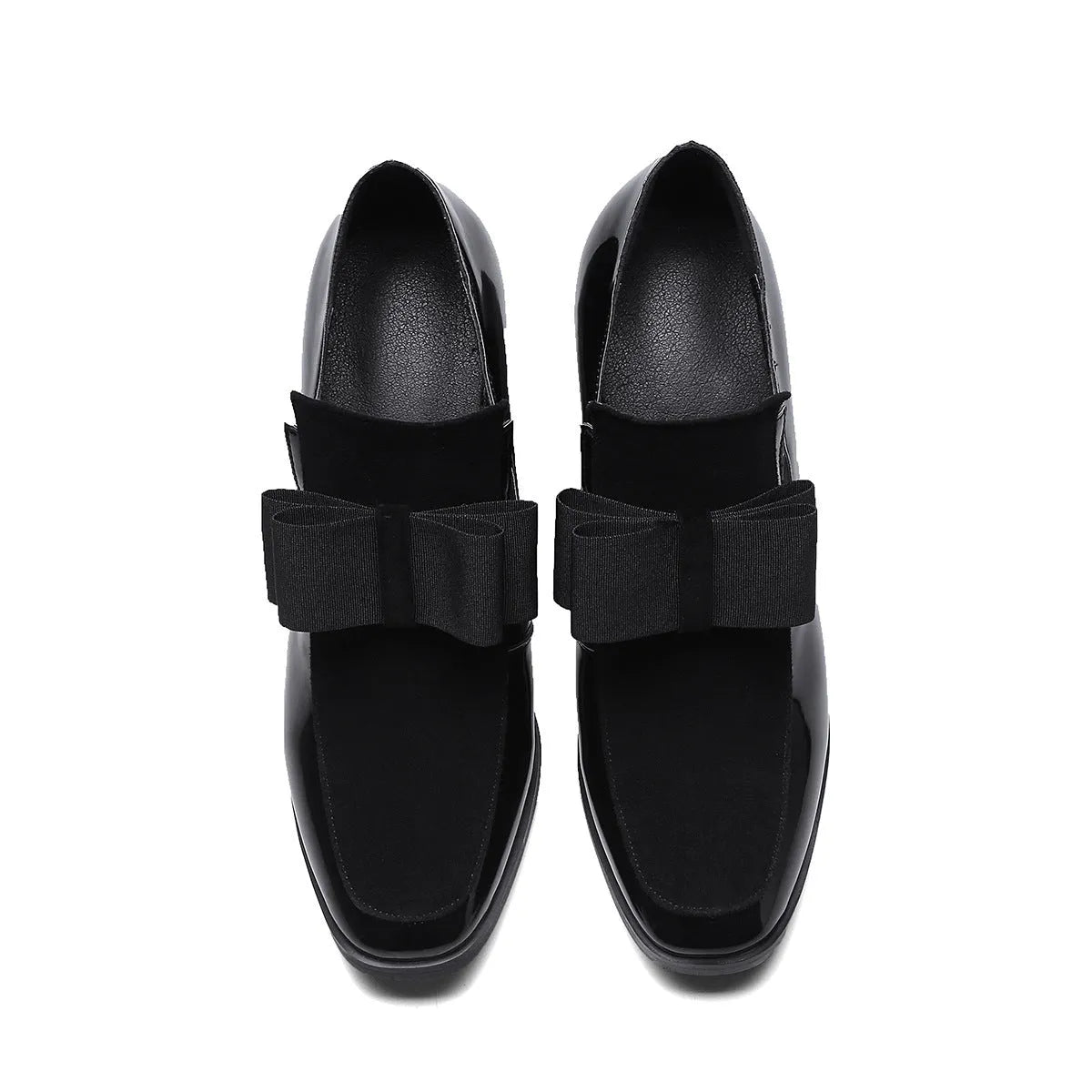Black leather women's high heel shoes with a thick block heel and square toe, showing patent leather finish.