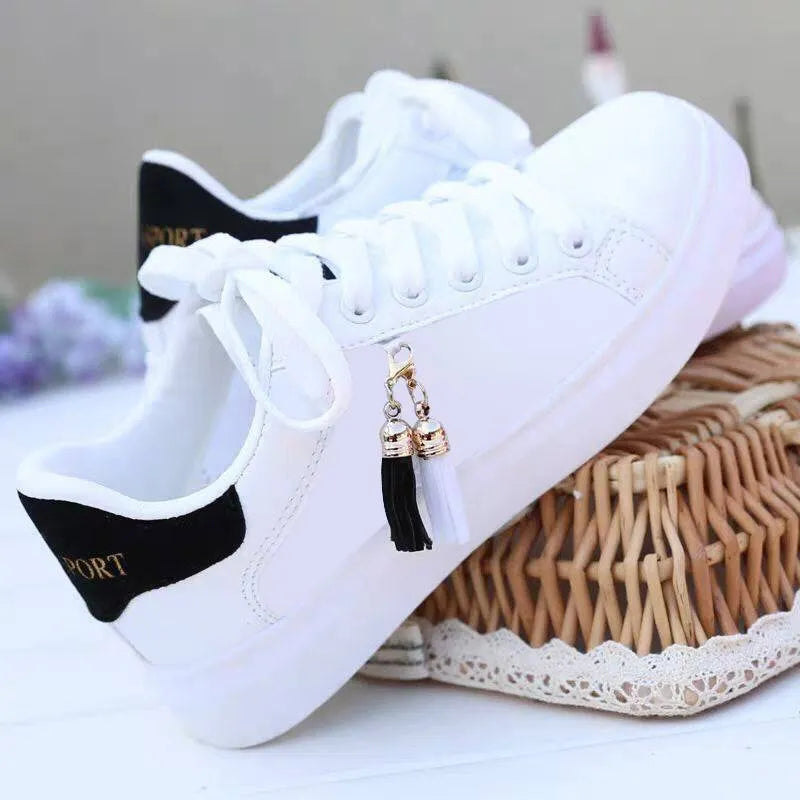 White mesh women's flat casual shoes with rubber sole and breathable inside.