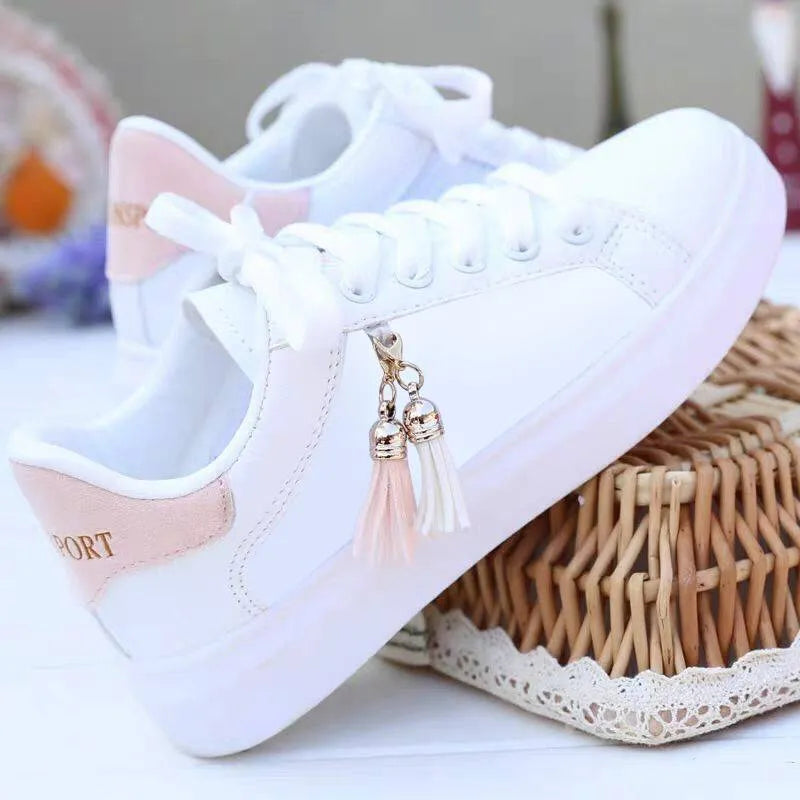White mesh women's flat casual shoes with rubber sole and breathable inside.