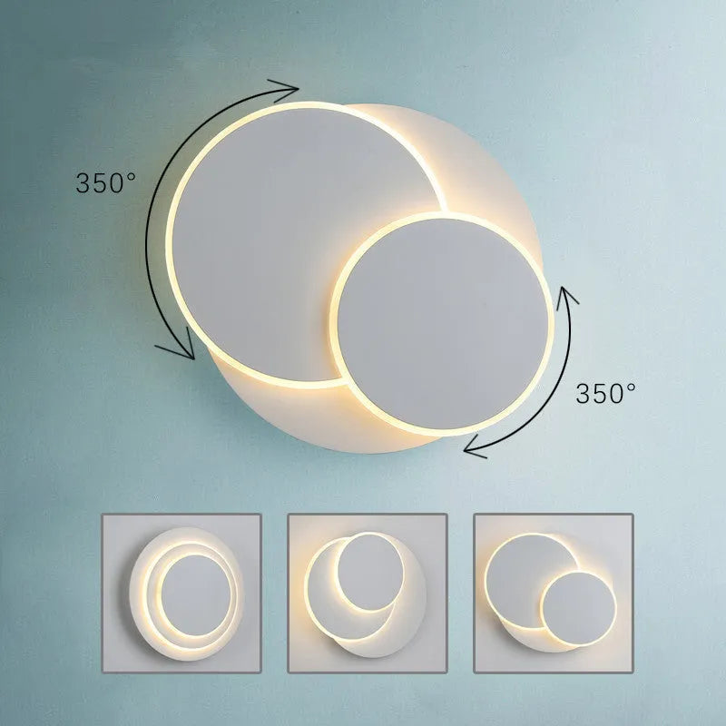 Modern round wall lamp with acrylic shade in black or white finish