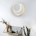 Modern round wall lamp with acrylic shade in black or white finish