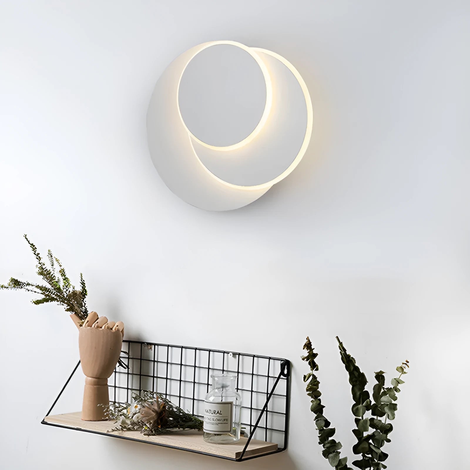Modern round wall lamp with acrylic shade in black or white finish