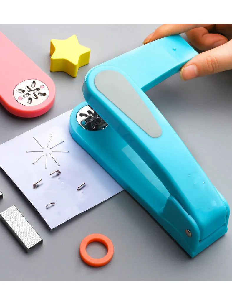 360-degree rotatable stapler in dark blue on a desk with A4 paper