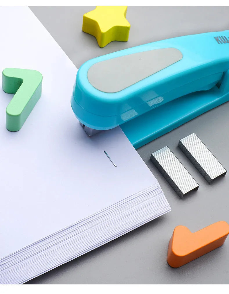 360-degree rotatable stapler in dark blue on a desk with A4 paper