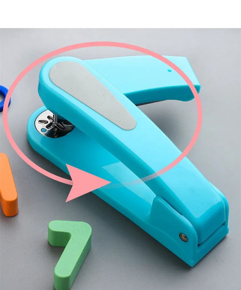 360-degree rotatable stapler in dark blue on a desk with A4 paper