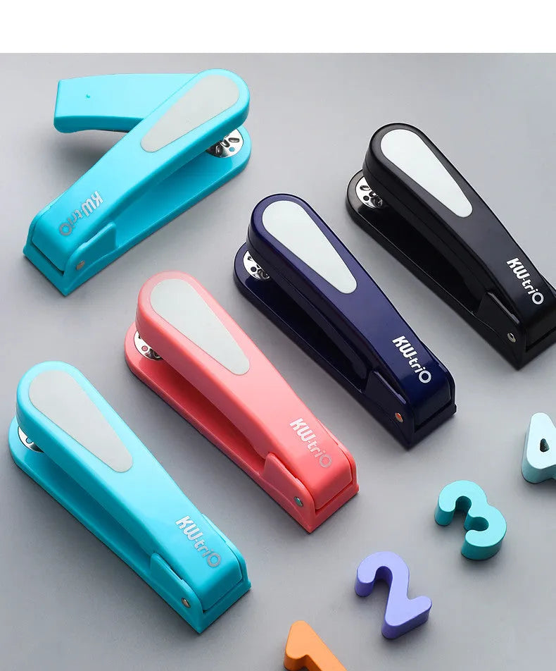 360-degree rotatable stapler in dark blue on a desk with A4 paper