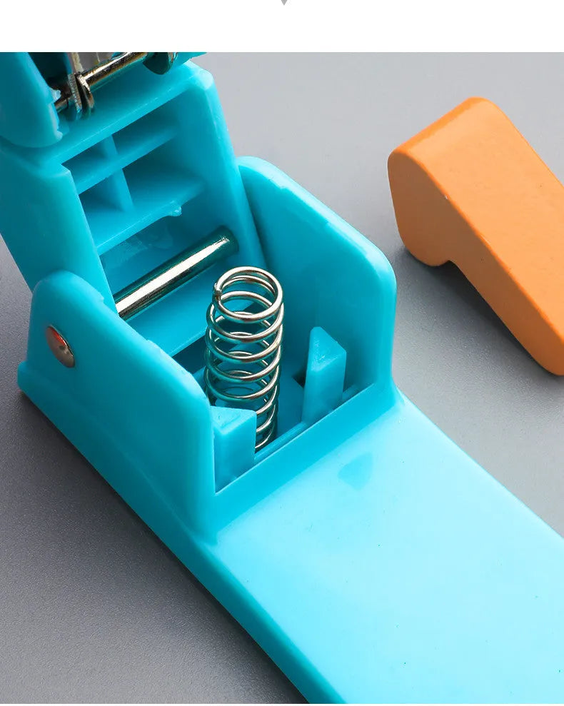 360-degree rotatable stapler in dark blue on a desk with A4 paper