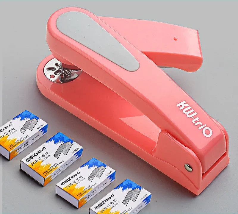 360-degree rotatable stapler in dark blue on a desk with A4 paper