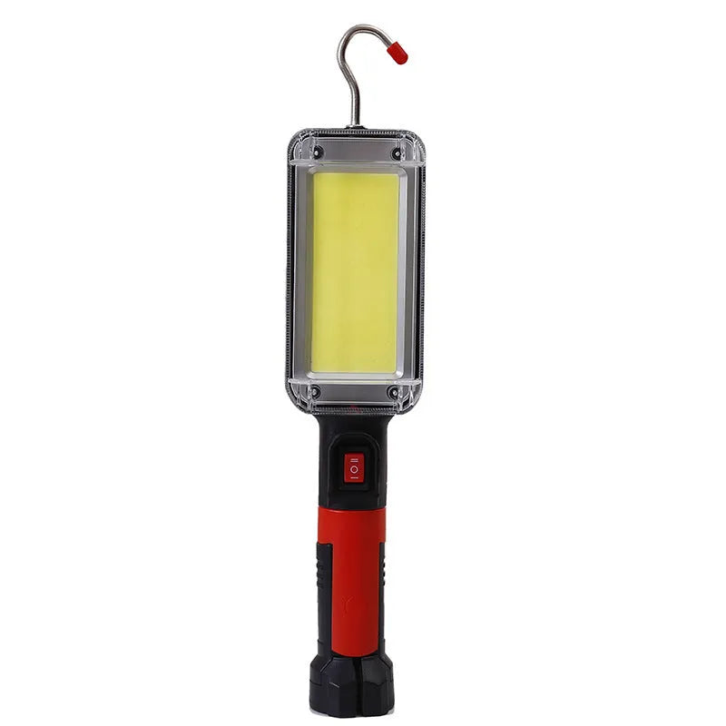 Red portable COB LED work light with a magnetic base and USB charging port.