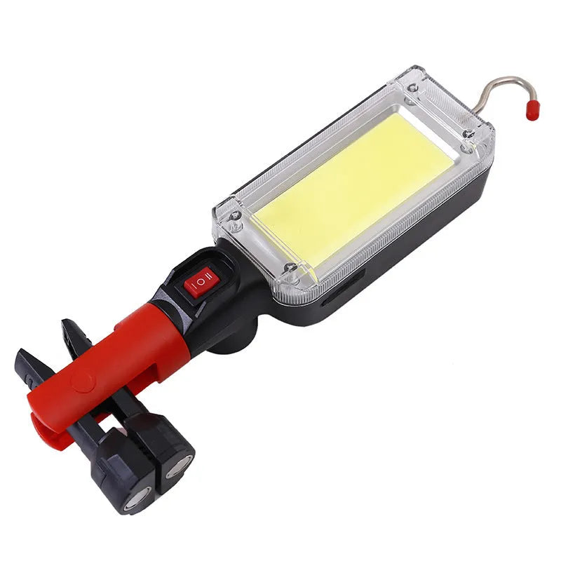 Red portable COB LED work light with a magnetic base and USB charging port.