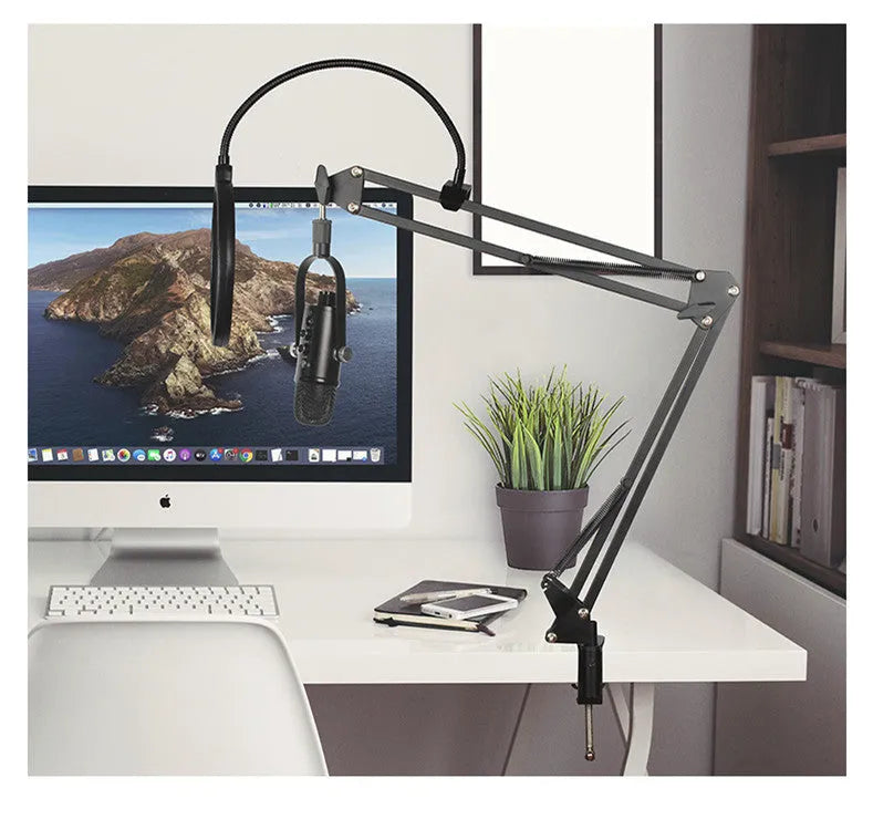 Black USB condenser microphone on a metal stand with a foam windscreen attached.