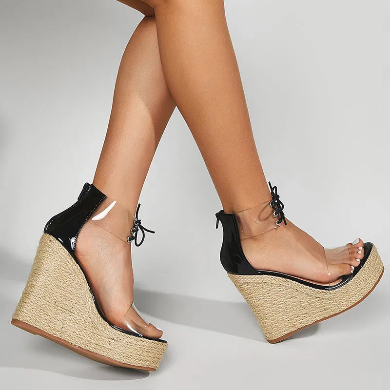 Black women's wedge sandals with hemp rope detail, high wedge heel, and front tie closure.